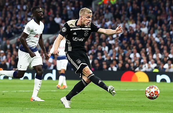 Ajax&#039;s van de Beek scores the only goal of the game as Tottenham players look on.