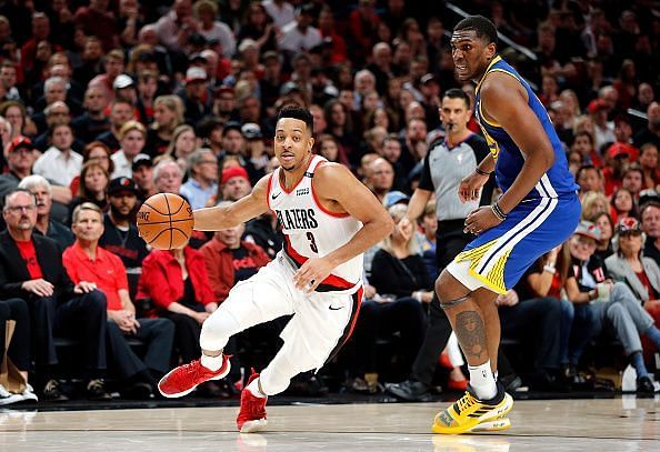 CJ McCollum (left) in action against Kevon Looney and the Golden State Warriors during their latest defeat