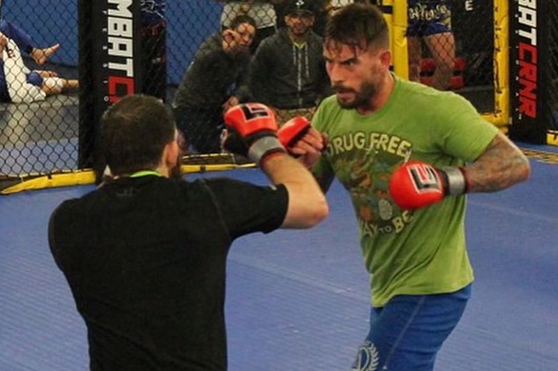 CM Punk training diligently for the octagon.