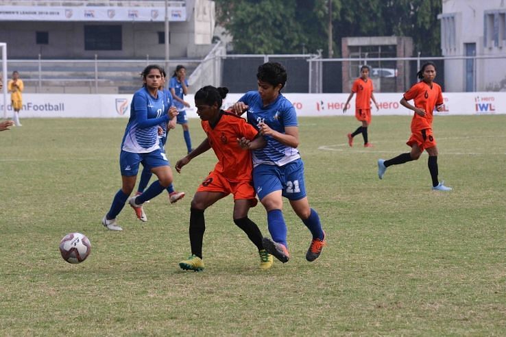 Dular Marandi (left) of SSB Women in a tussle for possession with Jyotika of Hans Women FC during their IWL match