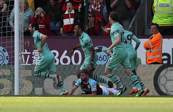 Arsenal players celebrate a goal in their final game of the season in the premier league against Burnley