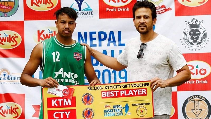 Anil Khadgi (L) of Kirtipur Basketball Club was declared Man of the Match