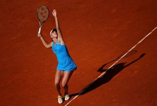 Belinda Bencic serving up a shot to Svetlana Kuznetsova at the Mutua Madrid Open