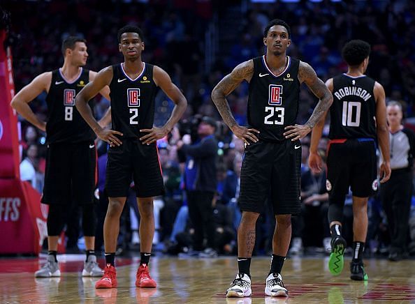 Dejected Los Angeles Clippers players after getting ousted by the Golden State Warriors