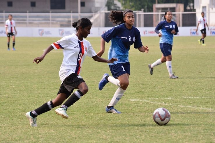 Bangalore United&#039;s Amsavalli Narayanan in a tussle for possession with Ishita Mankotia of Baroda Football Academy in the IWL