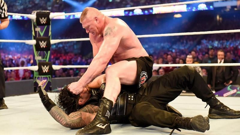 Brock Lesnar busted opens Roman Reigns.