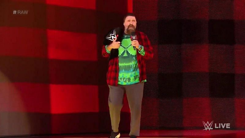 Mick Foley walking out with the title