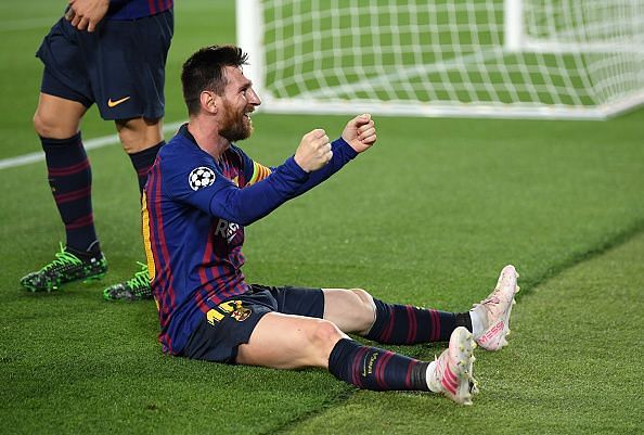 Messi celebrates a stunning free kick against Liverpool at Camp Nou.