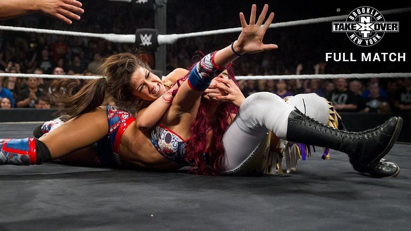 Sasha Banks struggles to escape from Bayley&#039;s submission attempt at NXT Takeover Brooklyn.