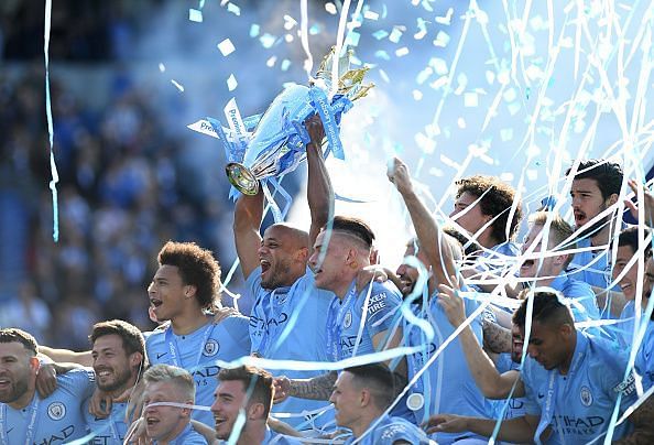 Vincent Kompany lifts the English Premier League trophy with typical emotion