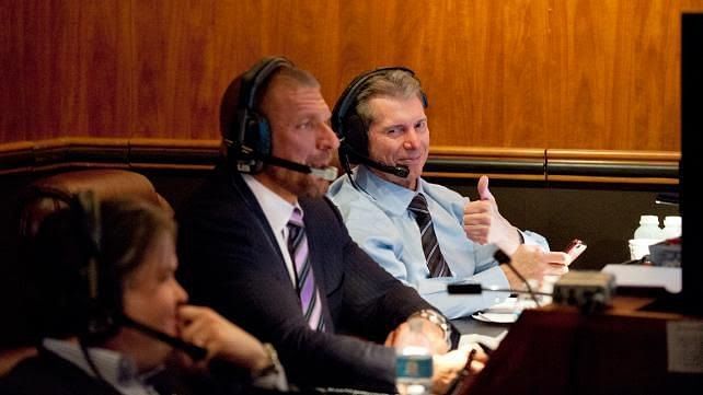 Vince McMahon (far right) and Triple H (center)