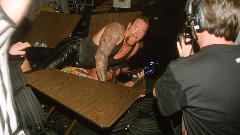 Somewhere beneath Undertaker and the splintered remnants of a table is Rob Van Dam.