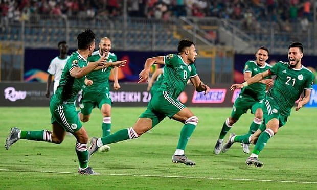 Algeria&acirc;€™s forward Youcef Belaili celebrates with his teammates after scoring the only goal of the match.
