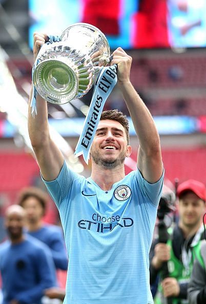 Laporte lifts the FA Cup with Manchester City.