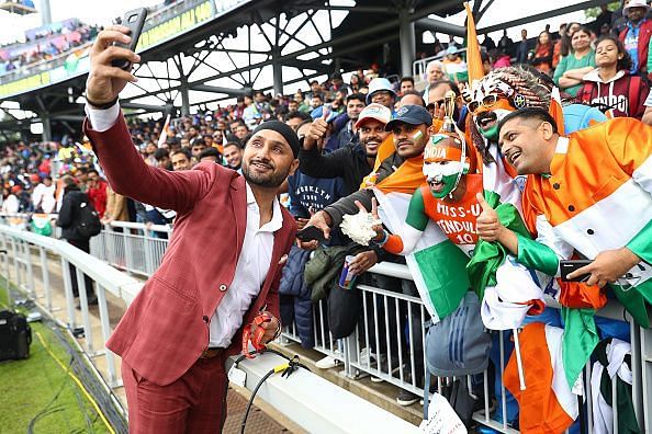 Harbhajan Singh clicks a picture with the fans during the India v Pakistan clash