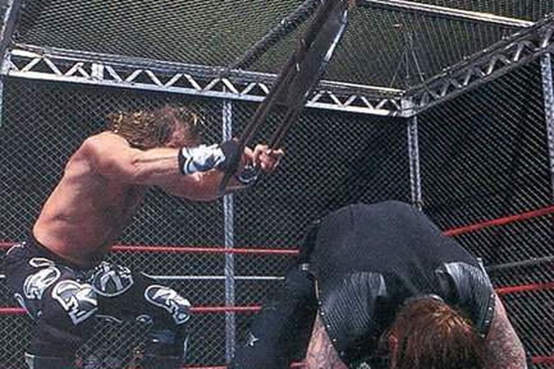 Shawn Michaels brutalizes the Undertaker in Hell in a Cell.
