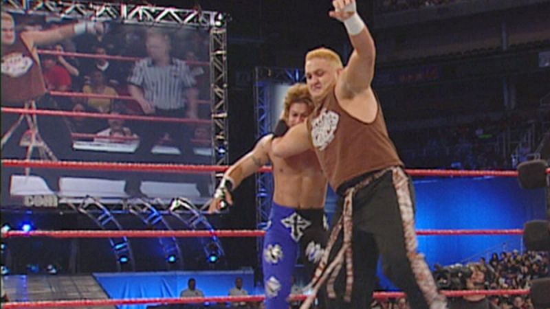 A blonde Samoa Joe wrestles former Light Heavyweight Champion Essa Rios in 2001