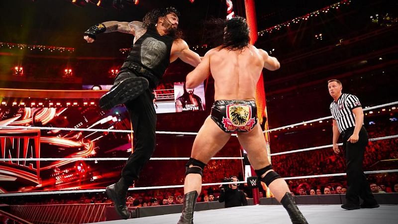 Roman Reigns delivering the Superman Punch to Drew McIntyre during their match at WrestleMania 35