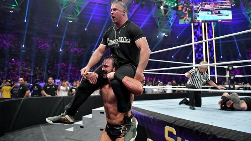 Drew McIntyre celebrating with Shane McMahon