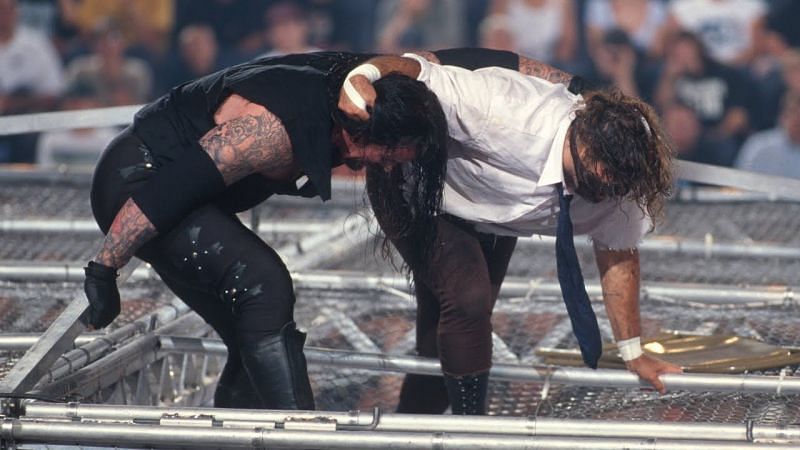 Undertaker and Mankind (Mick Foley) battle atop the Hell in a Cell structure.