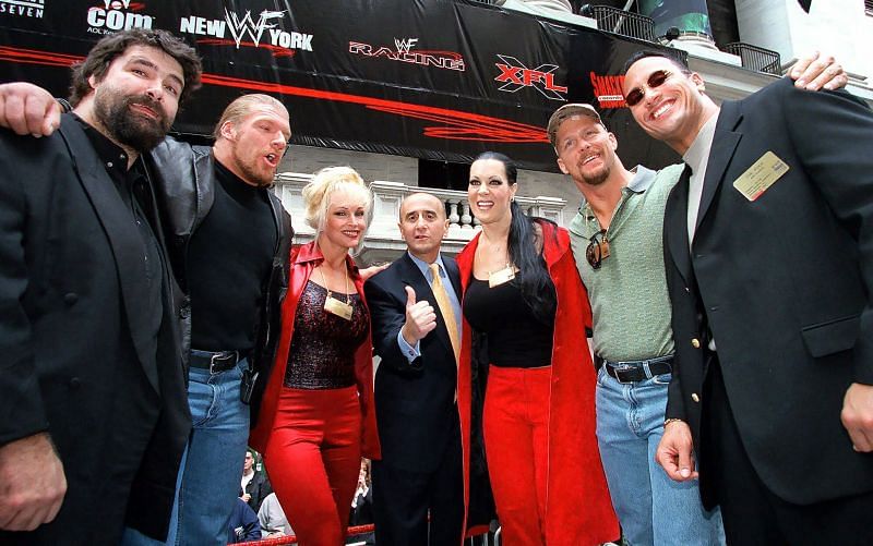 Mick Foley, Triple H, Debra, Chyna, Steve Austin, The Rock along with Richard A. Grasso (c), Chairman of the New York Stock Exchange post WWF being listed on NYSE.