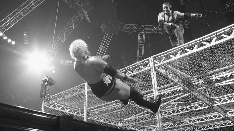 The Undertaker throws Rikishi Fatu off of the Hell in a Cell during Armageddon 1999.