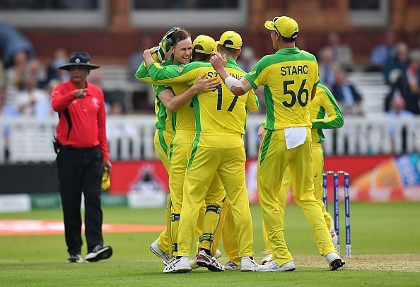 Jason Behrendorff celebrating a wicket with his teammates