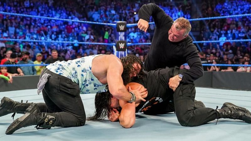 Shane McMahon and Elias attack Roman Reigns