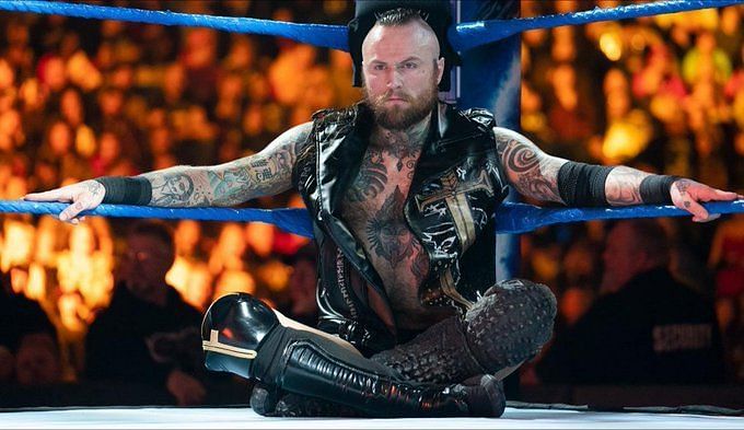 Which Superstar will step up to eventually confront Aleister Black?