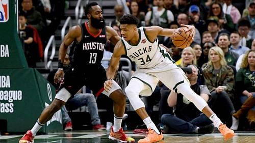 James Harden (L) guards Giannis Antetokounmpo (R)