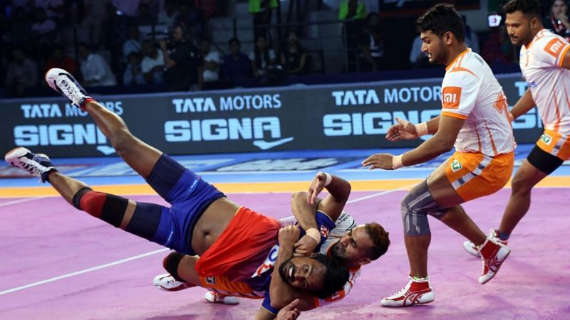 Sandeep Narwal (Puneri Paltan) tackling Chandran Ranjith of the Dabang Delhi single-handedly