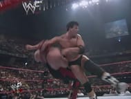 John Bradshaw Layfield, then known as Bradshaw, hits Vader with the Clothesline From Hell