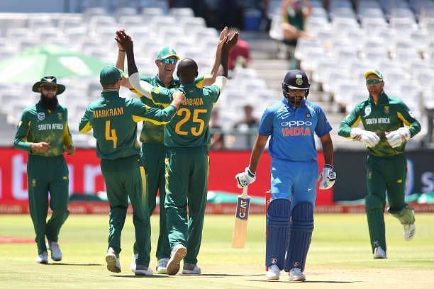Rohit Sharma surrounded by the South Africans