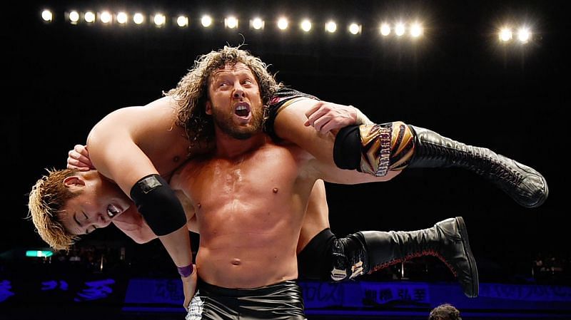 Kenny Omega hefts Okada onto his shoulders in NJPW.