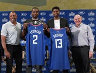 Kawhi poses for pictures alongside fellow new Clipper Paul George at their unveiling earlier this month