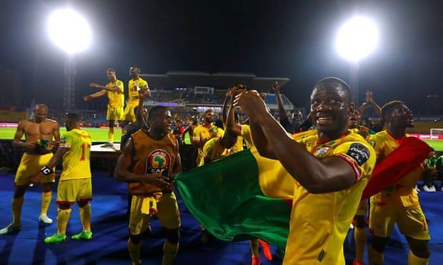 Benin celebrate a draw that sees them through to the round of 16.