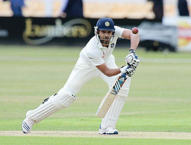 Rohit Sharma defends a ball on the front-foot.