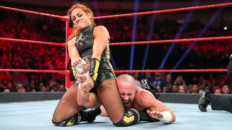 The Man Becky Lynch applies her Dis Arm Her finisher to a hapless Mike Kanellis.