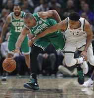 Al Horford vies for the ball