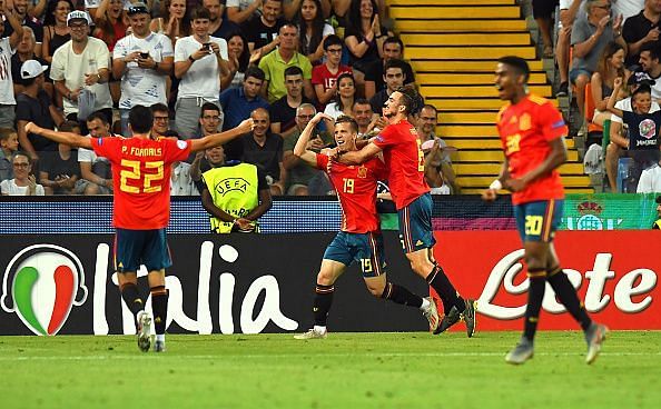 Olmo wheels away to celebrate with teammates after doubling Spain&#039;s advantage