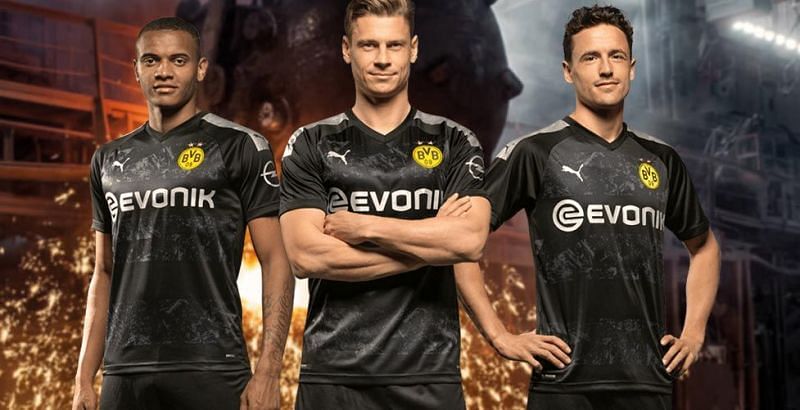 Akanji (left), Piszczek (center), and Delaney (right) showing off Dortmund&#039;s new uniform