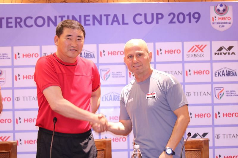 DPR Korea head coach Yun Jung Su shakes hands with his Syrian counterpart before the commencement of the Intercontinental Cup