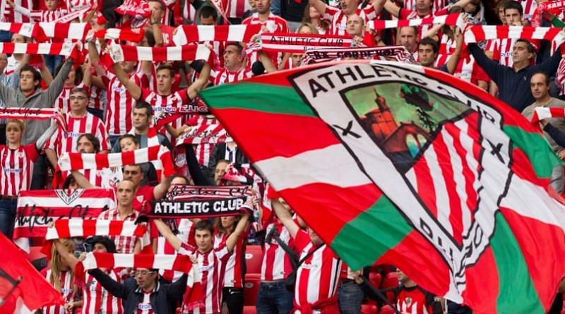The Bilbao fans proudly hoist the Basque colours. (Image Source: FourFourTwo)