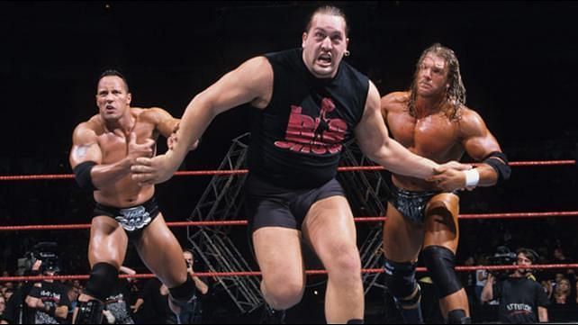 Triple H and The Rock form a temporary alliance against the Big Show.