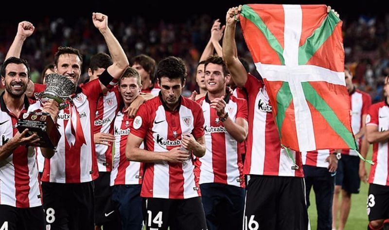 The Bilbao players with the Basque flag after winning the Spanish Super Cup. (Image Source: Sports Business Management)