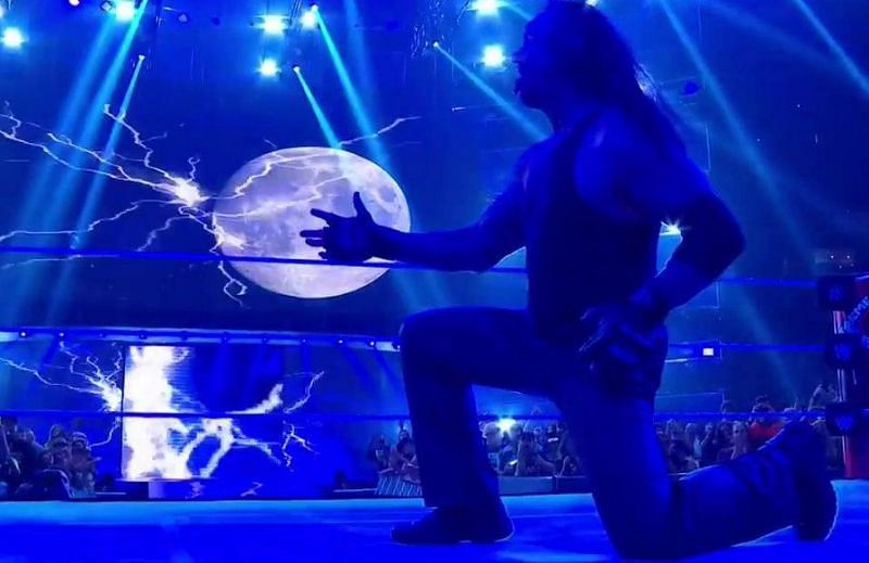 The Undertaker celebrates his tag team victory at WWE Extreme Rules