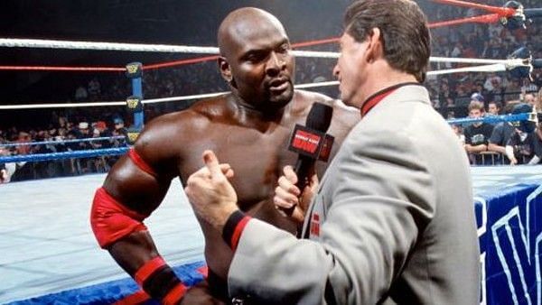 Ahmed Johnson with Vince McMahon in 1996