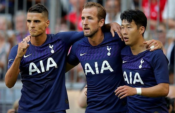 Harry Kane celebrates with Lamela and Son after opening the scoring in their Audi Cup semi-final win