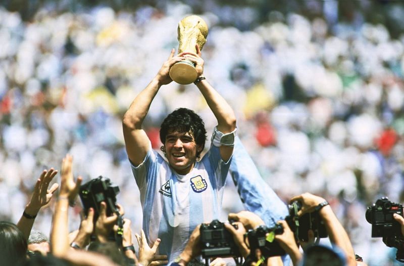 Maradona with the 1986 FIFA World Cup title