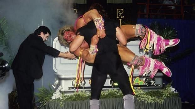Undertaker putting Warrior in a casket